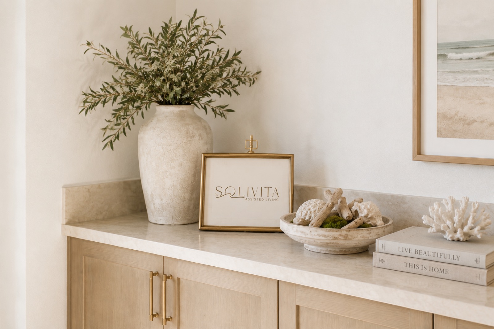 Solivita framed sign and coastal decor on entryway console